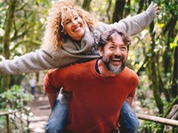 mature couple smiling with dental implants in Jonesboro