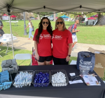 Two people at a community fair