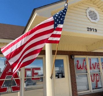 American flag waving outside of a building