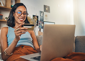 Woman sitting at her computer and smiling