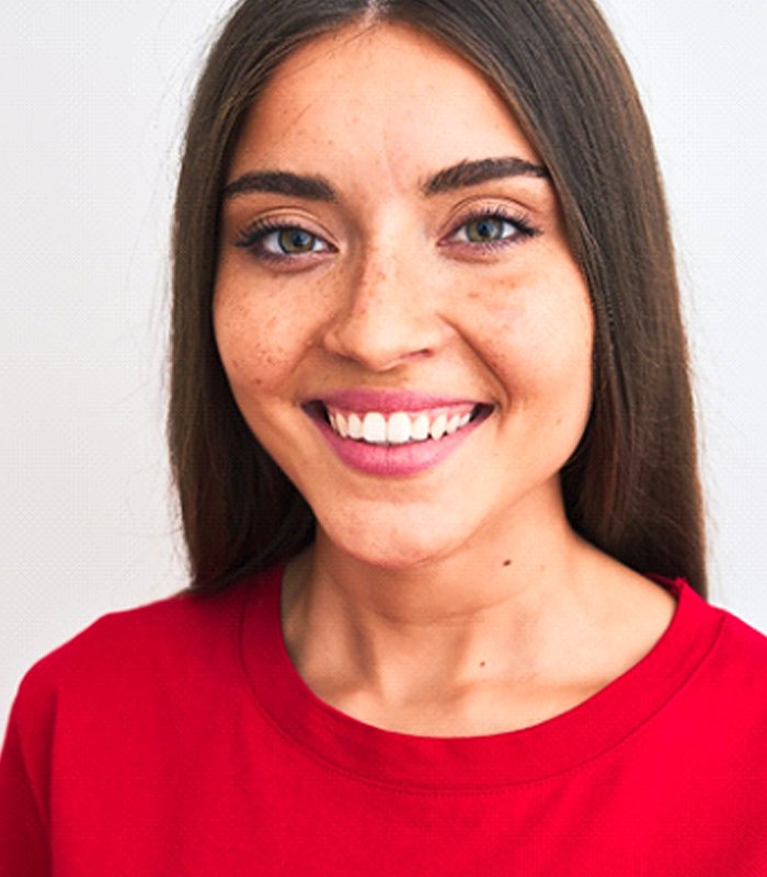 woman smiling after getting a dental bridge in Jonesboro