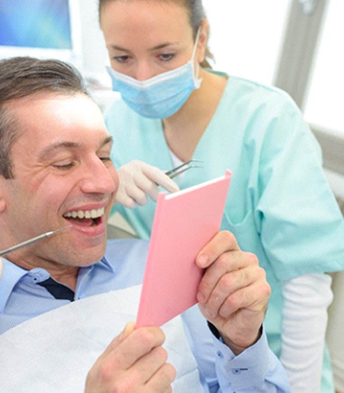 man smiling after getting dental bridge in Jonesboro