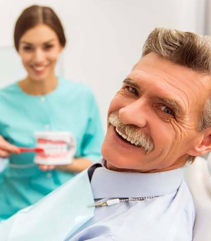 man visiting his denture dentist in Jonesboro
