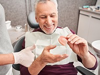 Dentist in Jonesboro, talking to patient about dentures