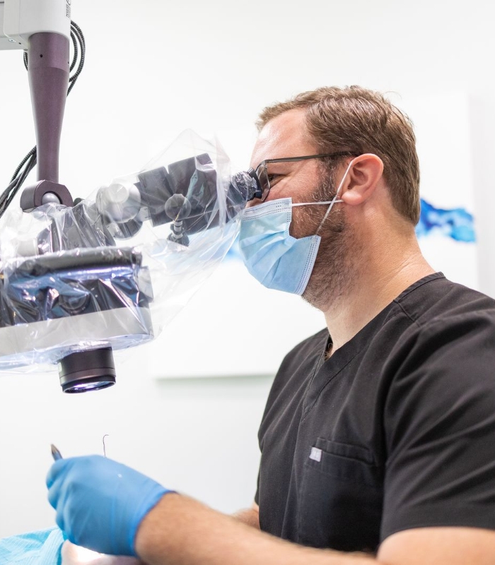 Model healthy tooth and tooth in need of root canal therapy