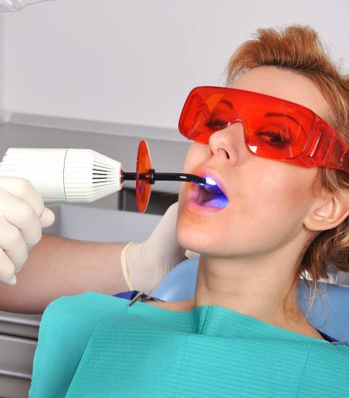 a patient undergoing the tooth colored filling process