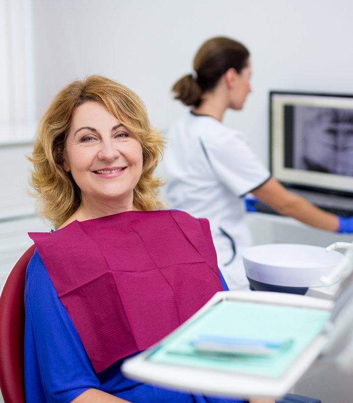 smiling woman in the dental chair 
