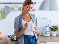 woman eating yogurt 