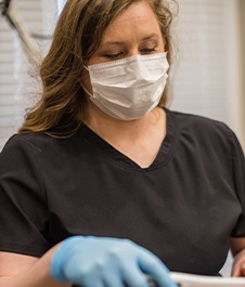 Jonesboro dental team member treating patient