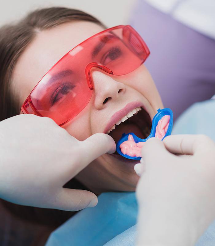 Patient receiving fluoride treatment