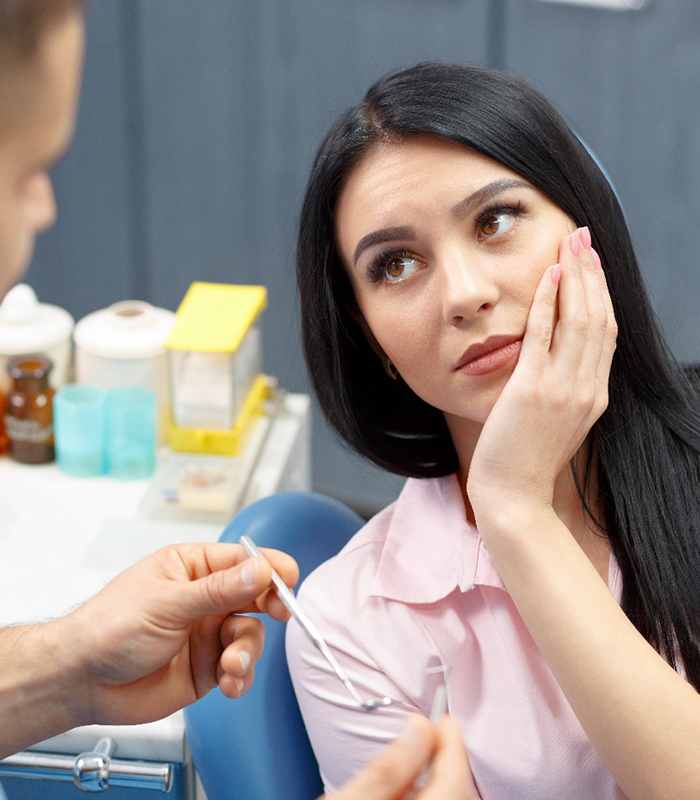 woman and dentist discussing a root canal in Jonesboro