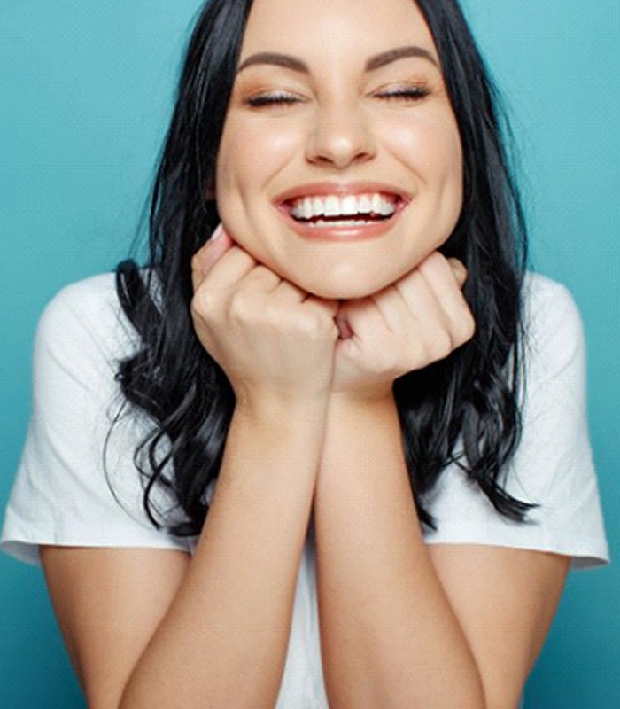 woman grinning from ear to ear