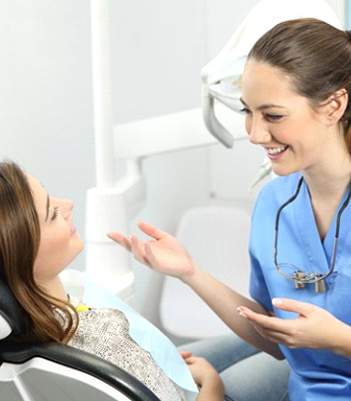 dental hygienist chatting with a patient
