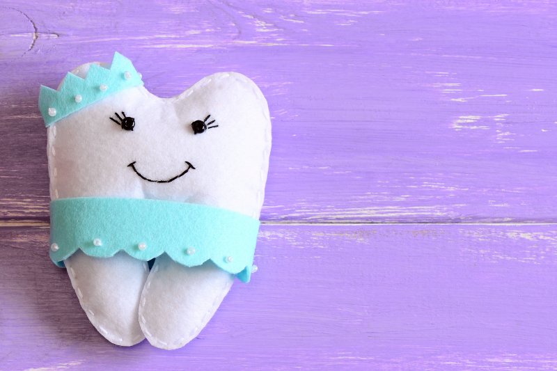 A closeup of a felt tooth fairy pillow