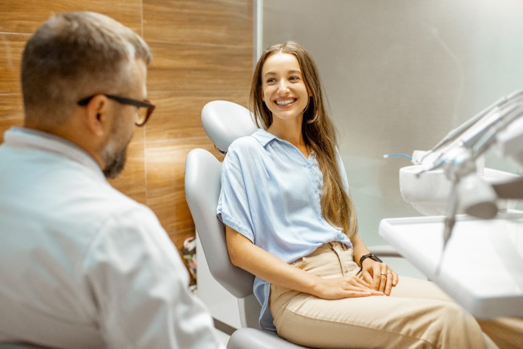 patient asking dentist questions before getting smile makeover