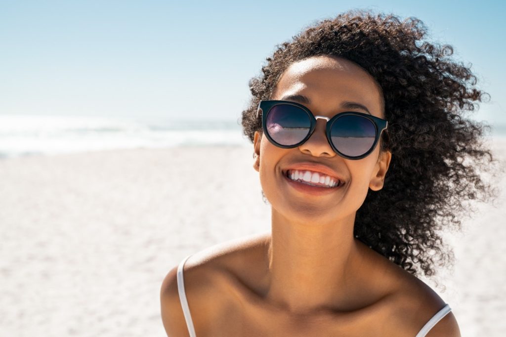 person with porcelain veneers smiling