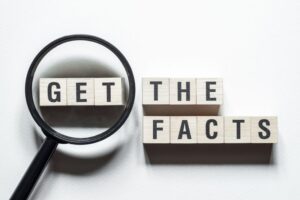 “Get the facts” wording with magnifying glass 