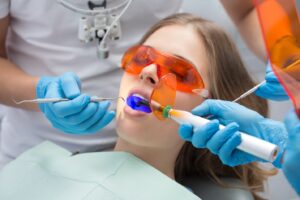 Female patient receiving a dental filling